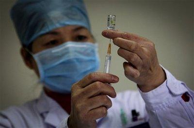 A&nbsp;health&nbsp;worker&nbsp;prepares&nbsp;a&nbsp;dose&nbsp;of&nbsp;H1N1&nbsp;vaccine&nbsp;at&nbsp;the&nbsp;start&nbsp;of&nbsp;free&nbsp;vaccination&nbsp;program&nbsp;intended&nbsp;for&nbsp;all&nbsp;Beijing&nbsp;residents&nbsp;at&nbsp;a&nbsp;clinic&nbsp;in&nbsp;Beijing,&nbsp;China,&nbsp;Monday,&nbsp;Nov.&nbsp;16,&nbsp;2009.&nbsp;Health&nbsp;experts&nbsp;say&nbsp;extraordinary&nbsp;measures&nbsp;against&nbsp;swine&nbsp;flu-&nbsp;most&nbsp;notably&nbsp;quarantines&nbsp;imposed&nbsp;by&nbsp;China,&nbsp;where&nbsp;entire&nbsp;planeloads&nbsp;of&nbsp;passengers&nbsp;were&nbsp;isolated&nbsp;if&nbsp;one&nbsp;traveler&nbsp;had&nbsp;symptoms-&nbsp;have&nbsp;failed&nbsp;to&nbsp;contain&nbsp;the&nbsp;disease.