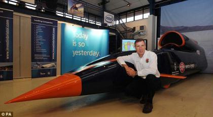 Wing&nbsp;Commander&nbsp;Andy&nbsp;Green&nbsp;poses&nbsp;today&nbsp;in&nbsp;front&nbsp;of&nbsp;a&nbsp;three-quarter&nbsp;scale&nbsp;model&nbsp;of&nbsp;the&nbsp;front&nbsp;section&nbsp;of&nbsp;the&nbsp;Bloodhound&nbsp;SSC.&nbsp;Wg&nbsp;Cdr&nbsp;Green&nbsp;will&nbsp;be&nbsp;the&nbsp;one&nbsp;at&nbsp;the&nbsp;helm&nbsp;of&nbsp;the&nbsp;1,000mph&nbsp;vehicle