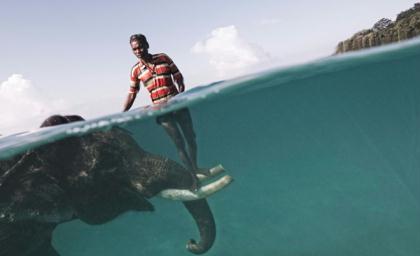 Nazroo,&nbsp;a&nbsp;mahout&nbsp;(elephant&nbsp;driver),&nbsp;poses&nbsp;for&nbsp;a&nbsp;portrait&nbsp;while&nbsp;taking&nbsp;his&nbsp;elephant,&nbsp;Rajan,&nbsp;out&nbsp;for&nbsp;a&nbsp;swim&nbsp;in&nbsp;front&nbsp;of&nbsp;Radha&nbsp;Nagar&nbsp;Beach&nbsp;in&nbsp;Havelock,&nbsp;Andaman&nbsp;Islands.&nbsp;Rajan&nbsp;is&nbsp;one&nbsp;of&nbsp;the&nbsp;few&nbsp;elephants&nbsp;in&nbsp;Havelock&nbsp;that&nbsp;can&nbsp;swim,&nbsp;so&nbsp;when&nbsp;he&nbsp;is&nbsp;not&nbsp;dragging&nbsp;timber&nbsp;in&nbsp;the&nbsp;forest&nbsp;he&nbsp;is&nbsp;used&nbsp;as&nbsp;a&nbsp;tourist&nbsp;attraction.&nbsp;The&nbsp;relationship&nbsp;between&nbsp;the&nbsp;mahout&nbsp;and&nbsp;his&nbsp;elephant&nbsp;usually&nbsp;lasts&nbsp;for&nbsp;their&nbsp;entire&nbsp;lives,&nbsp;creating&nbsp;an&nbsp;extremely&nbsp;strong&nbsp;tie&nbsp;between&nbsp;the&nbsp;animal&nbsp;and&nbsp;the&nbsp;human&nbsp;being.&nbsp;(Photo&nbsp;and&nbsp;caption&nbsp;by&nbsp;Cesare&nbsp;Naldi)&nbsp;