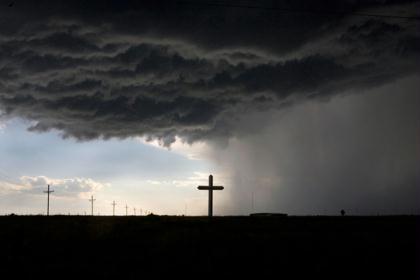 On&nbsp;the&nbsp;final&nbsp;leg&nbsp;of&nbsp;a&nbsp;six-week&nbsp;United&nbsp;States&nbsp;of&nbsp;America&nbsp;road&nbsp;trip,&nbsp;I&nbsp;was&nbsp;driving&nbsp;east&nbsp;across&nbsp;Interstate&nbsp;40&nbsp;when&nbsp;a&nbsp;spot&nbsp;storm&nbsp;with&nbsp;golf&nbsp;ball-sized&nbsp;hail&nbsp;struck.&nbsp;A&nbsp;sign&nbsp;near&nbsp;Groom,&nbsp;Texas,&nbsp;announcing&nbsp;the&nbsp;"largest&nbsp;cross&nbsp;in&nbsp;the&nbsp;western&nbsp;hemisphere"&nbsp;explained&nbsp;the&nbsp;large&nbsp;crucifix&nbsp;I抎&nbsp;been&nbsp;wondering&nbsp;about&nbsp;for&nbsp;miles&nbsp;on&nbsp;the&nbsp;highway;&nbsp;it&nbsp;seemed&nbsp;like&nbsp;an&nbsp;OK&nbsp;place&nbsp;to&nbsp;wait&nbsp;out&nbsp;the&nbsp;storm.&nbsp;On&nbsp;my&nbsp;way&nbsp;to&nbsp;getting&nbsp;stuck&nbsp;in&nbsp;the&nbsp;mud&nbsp;and&nbsp;a&nbsp;giant&nbsp;double&nbsp;rainbow,&nbsp;I&nbsp;saw&nbsp;this&nbsp;silhouetted&nbsp;view&nbsp;of&nbsp;the&nbsp;cross,&nbsp;splitting&nbsp;the&nbsp;sunny&nbsp;sky&nbsp;from&nbsp;the&nbsp;stormy&nbsp;plains.&nbsp;(Photo&nbsp;and&nbsp;caption&nbsp;by&nbsp;Brad&nbsp;Maule)&nbsp;