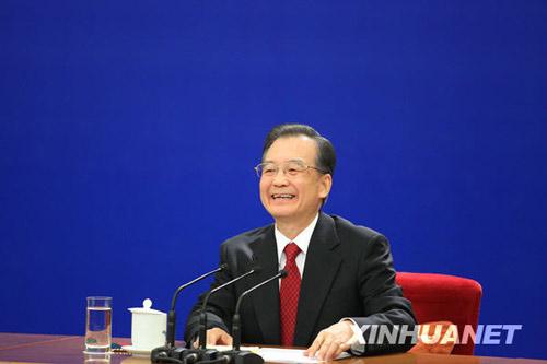 Chinese Premier Wen Jiabao smiles during a press conference after the closing meeting of the Third Session of the 11th National People's Congress (NPC) at the Great Hall of the People in Beijing, capital of China, March 14, 2010. (Xinhua/Xing Guangli)