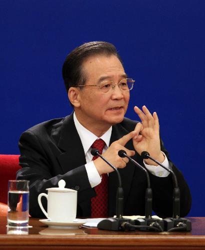 Chinese Premier Wen Jiabao answers questions during a press conference after the closing meeting of the Third Session of the 11th National People's Congress (NPC) at the Great Hall of the People in Beijing, capital of China, March 14, 2010. (Xinhua/Ju Peng)