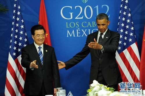 Chinese President Hu Jintao met his U.S. counterpart Barack Obama Tuesday in Los Cabos, Mexico.