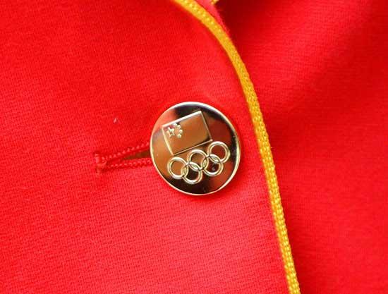 Chinese athletes show off the official uniforms for the Chinese national team for London Olympic Games at an unveiling ceremony in Beijing, June 25, 2012. (Photo/Xinhua)