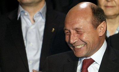 Romania's&nbsp;President&nbsp;in&nbsp;office,&nbsp;Traian&nbsp;Basescu,&nbsp;smiles&nbsp;upon&nbsp;seeing&nbsp;exit&nbsp;polls&nbsp;in&nbsp;Bucharest,&nbsp;Romania,&nbsp;Sunday&nbsp;Nov.&nbsp;22,&nbsp;2009.&nbsp;Romania&nbsp;held&nbsp;presidential&nbsp;elections,&nbsp;the&nbsp;first&nbsp;since&nbsp;the&nbsp;country&nbsp;joined&nbsp;the&nbsp;European&nbsp;Union&nbsp;in&nbsp;2007.According&nbsp;to&nbsp;exit&nbsp;polls&nbsp;Basescu&nbsp;leads&nbsp;after&nbsp;the&nbsp;first&nbsp;round&nbsp;followed&nbsp;by&nbsp;the&nbsp;Social&nbsp;Democracy&nbsp;Party&nbsp;candidate&nbsp;Mircea&nbsp;Geoana.&nbsp;An&nbsp;election&nbsp;runoff&nbsp;will&nbsp;be&nbsp;held&nbsp;on&nbsp;Dec.&nbsp;6.(AP&nbsp;Photo&nbsp;/&nbsp;Vadim&nbsp;Ghirda)&nbsp;
