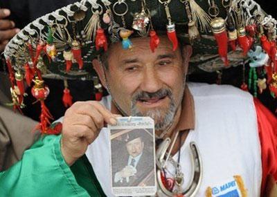 A&nbsp;demonstrator&nbsp;parades&nbsp;during&nbsp;a&nbsp;pre-electoral&nbsp;rally&nbsp;of&nbsp;Italian&nbsp;Prime&nbsp;Minister&nbsp;Silvio&nbsp;Berlusconi's&nbsp;ruling&nbsp;center-right&nbsp;party&nbsp;