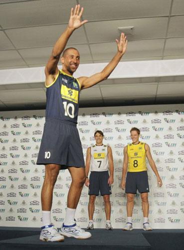 Brazil's volleyball players Sergio dos Santos (L), Giba Godoy and Murilo Endres (R) present the new national team uniform for the London 2012 Olympic Games at Brazilian Volleyball Federation training centre in Saquarema, about 60 miles (97 km) east of Rio de Janeiro, May 4, 2012.