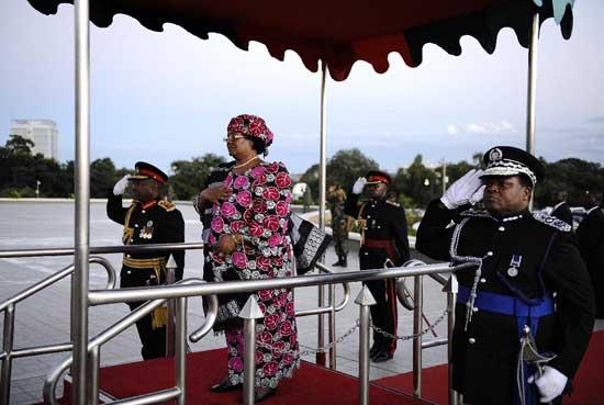 Joyce Banda inspects the guard of honour during her inauguration as Malawi's new president. Banda has won praise for keeping a young democracy on track, but southern Africa's first woman leader must now put the brakes on an economic and diplomatic nosedive.