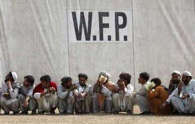 Men,&nbsp;fleeing&nbsp;a&nbsp;military&nbsp;offensive&nbsp;in&nbsp;South&nbsp;Waziristan,&nbsp;sit&nbsp;in&nbsp;a&nbsp;queue&nbsp;for&nbsp;handouts&nbsp;under&nbsp;a&nbsp;sign&nbsp;for&nbsp;the&nbsp;United&nbsp;Nations&nbsp;World&nbsp;Food&nbsp;Programme&nbsp;(WFP)&nbsp;at&nbsp;a&nbsp;food&nbsp;distribution&nbsp;point&nbsp;in&nbsp;Dera&nbsp;Ismail&nbsp;Khan,&nbsp;located&nbsp;in&nbsp;Pakistan's&nbsp;restive&nbsp;North&nbsp;West&nbsp;Frontier&nbsp;Province&nbsp;November&nbsp;9,&nbsp;2009.REUTERS/Akhta&nbsp;Soomro