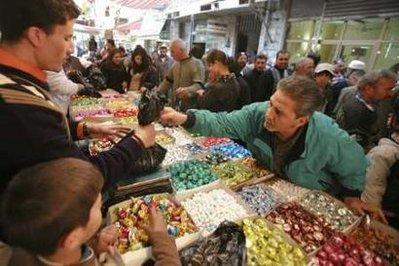 Customers&nbsp;buy&nbsp;sweets&nbsp;from&nbsp;vendors&nbsp;ahead&nbsp;of&nbsp;the&nbsp;Muslim&nbsp;Eid&nbsp;al-Adha&nbsp;festival&nbsp;in&nbsp;downtown&nbsp;Amman&nbsp;November&nbsp;26,&nbsp;2009.&nbsp;Muslims&nbsp;around&nbsp;the&nbsp;world&nbsp;celebrate&nbsp;Eid&nbsp;al-Adha&nbsp;by&nbsp;slaughtering&nbsp;sheep,&nbsp;goats,&nbsp;camels&nbsp;and&nbsp;cows&nbsp;to&nbsp;commemorate&nbsp;Prophet&nbsp;Abraham's&nbsp;willingness&nbsp;to&nbsp;sacrifice&nbsp;his&nbsp;son,&nbsp;Ismail,&nbsp;on&nbsp;God's&nbsp;command.REUTERS/Muhammad&nbsp;Hamed