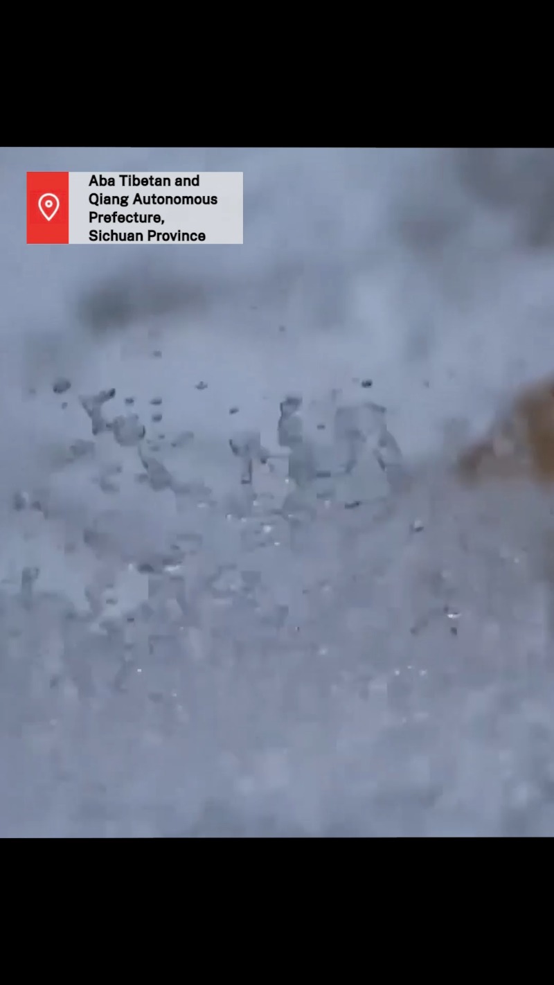 spring snowfall creates stunning scenery at zhaga waterfall