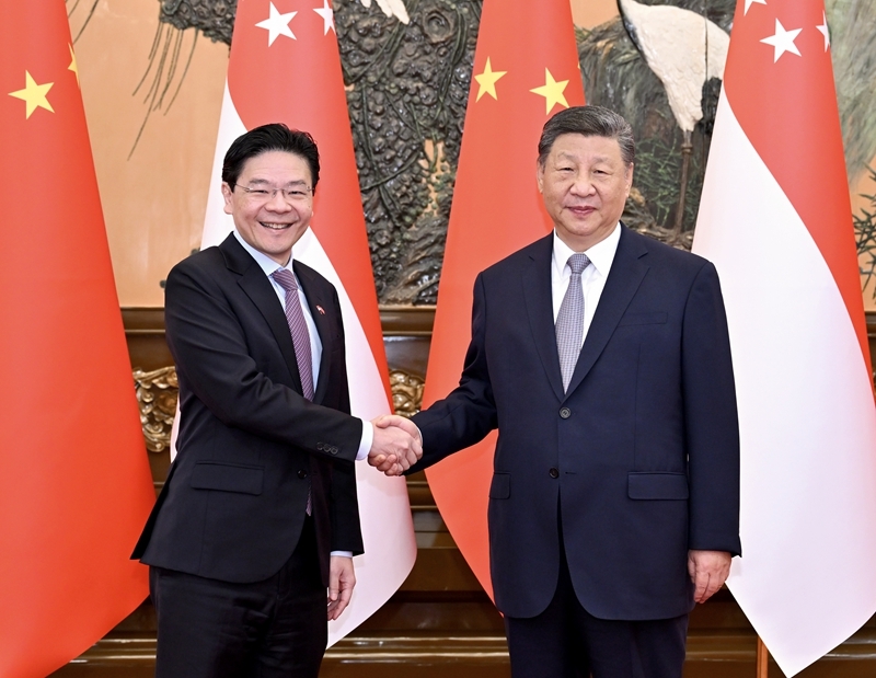 6月24日上午，国家主席习近平在北京人民大会堂会见来华进行正式访问的新加坡总理黄循财。