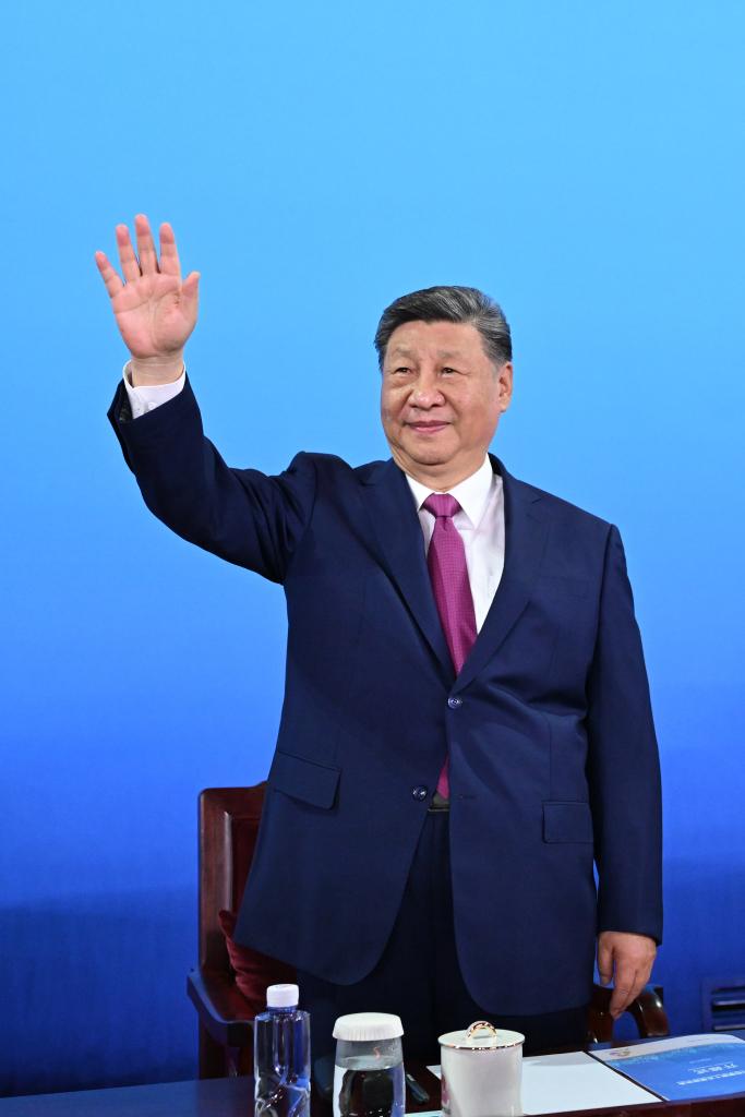 Chinese President Xi Jinping, also general secretary of the Communist Party of China Central Committee and chairman of the Central Military Commission, waves during the opening ceremony of China